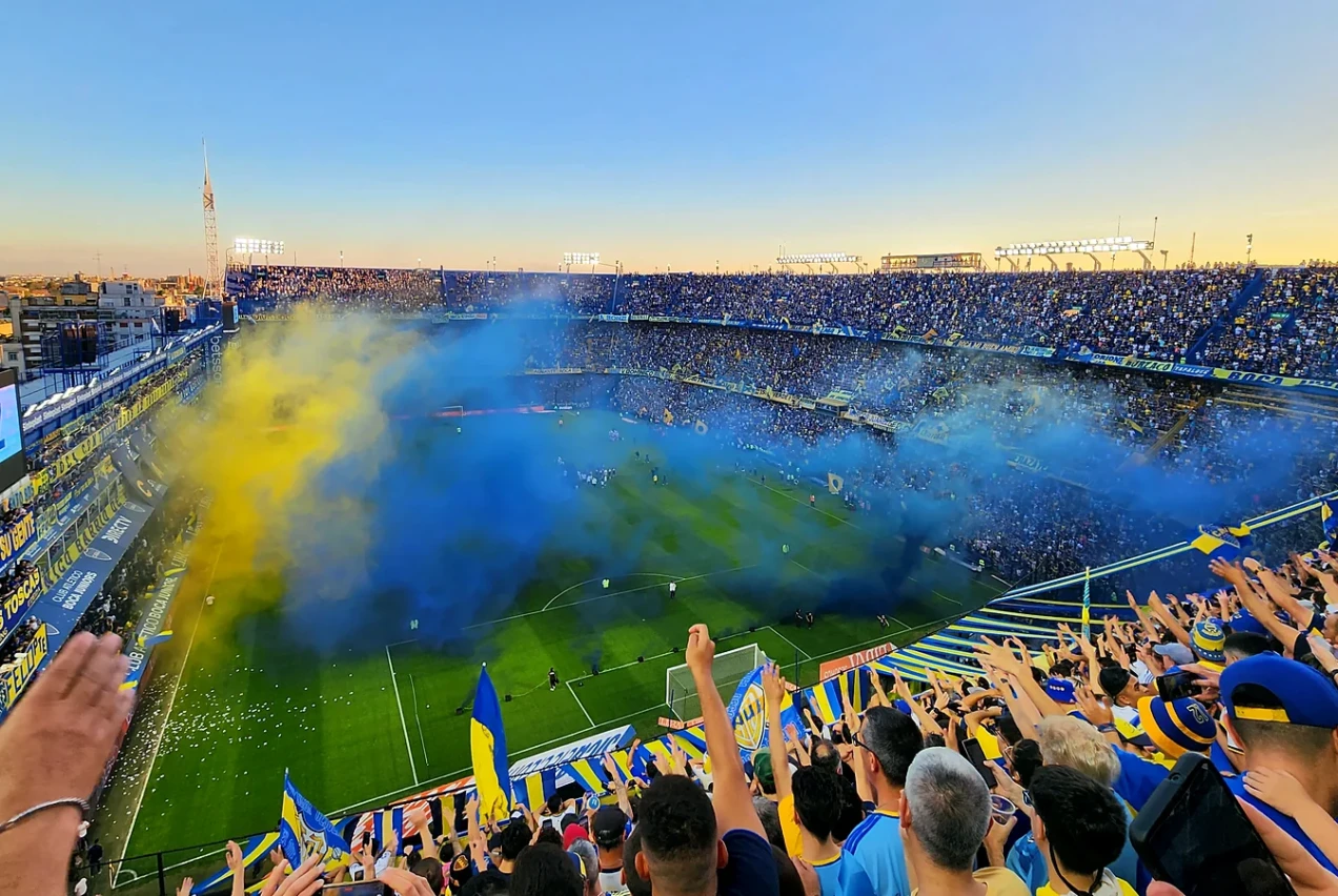 Boca Juniors supporters fill La Bombonera with blue and yellow smoke and flags on matchday in Buenos Aires