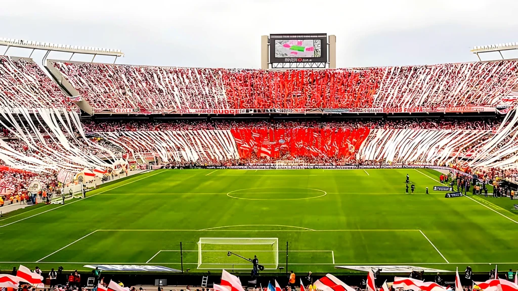 River Plate fans hold a red and white tifo across the Estadio Monumental in Buenos Aires